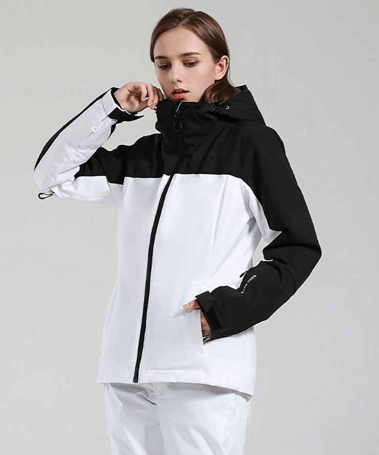 Women's ski jacket in black and white, windproof and waterproof, perfect for extreme winter sports, featuring a hood for added warmth.